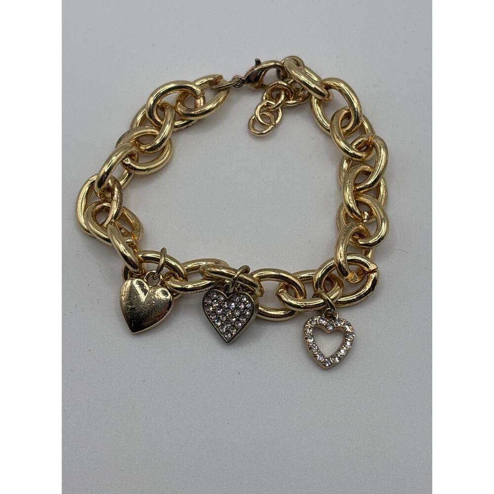 Gold toned cubic zirconia three heart bracelet 7-8” adjustable